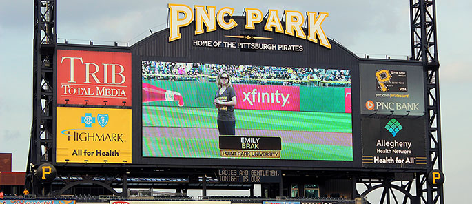 Point Park University student Emily Brak throws out the first pitch at PNC Park on April 17, 2015.