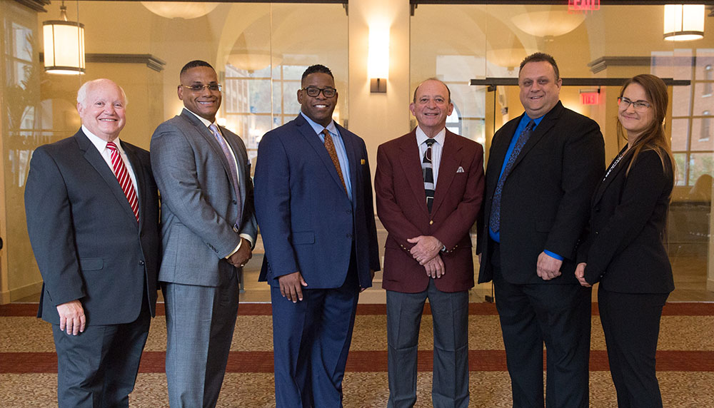 Pictured are Professors Linzer and Botta with the 2018 criminal justice administration graduate students. Photo by Randall Coleman.