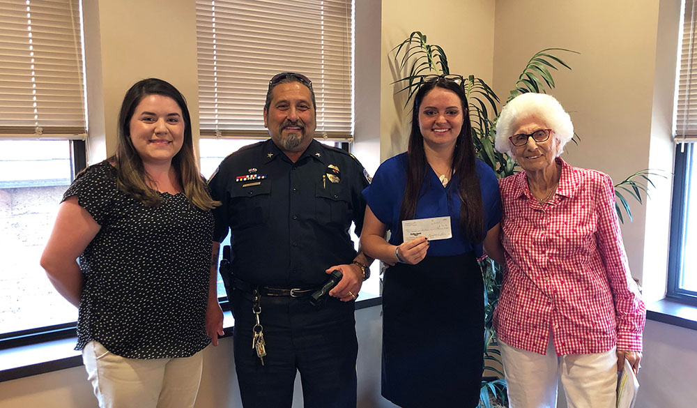 Pictured are Point Park students Lizzie Geis and Emily Weaver with the mayor and police chief of Homestead Borough. Photo submitted by Geis.