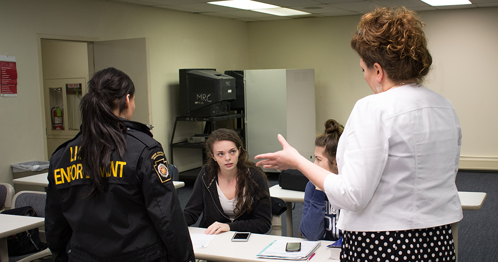 Pictured is the PA Liquor Control Board officers with Point Park criminal justice students. Photo by Brandy Richey.