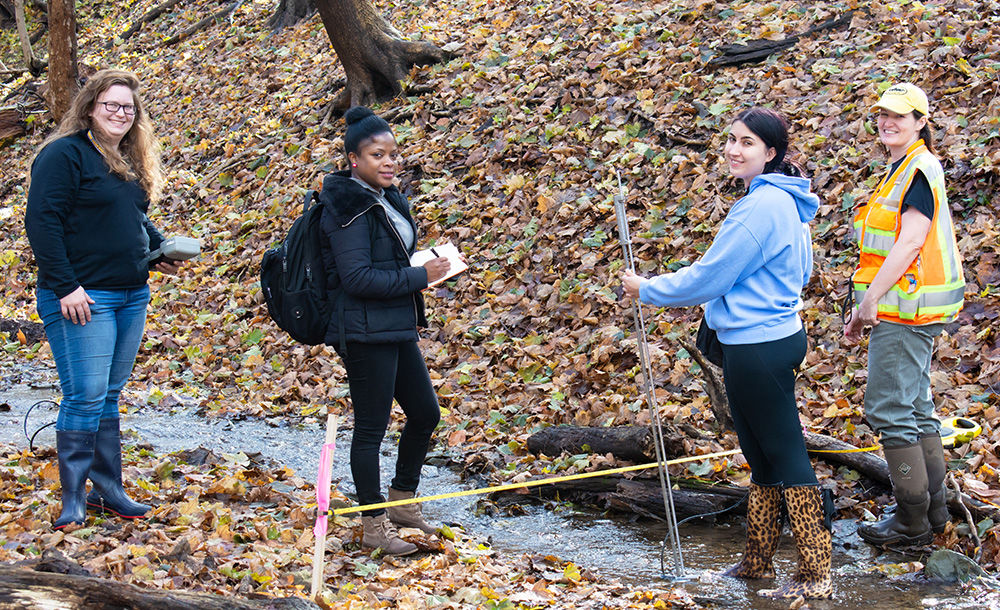Pictured are Master of Science students measuring stream flow at Schenley Park. Photo by Brandy Richey