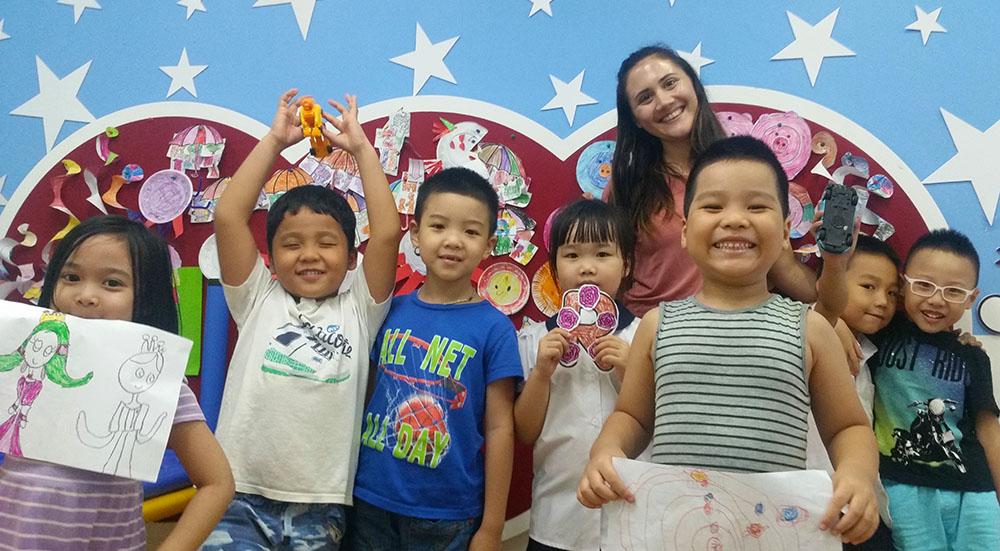 Pictured is global cultural studies alumna with Kindergarten students in Hanoi, Vietnam. Photo submitted by Roux.