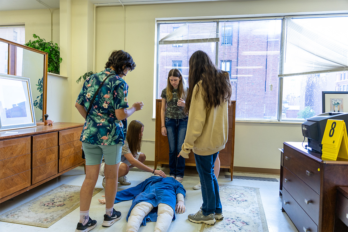 Students investigate a fictional crime scene at Point Park University.