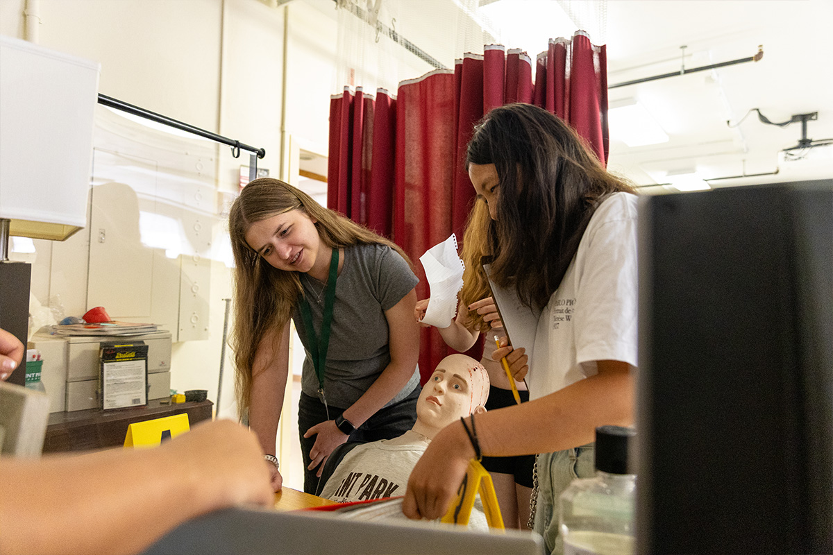 Students investigate a fictional crime scene at Point Park University.