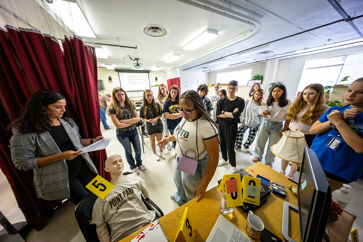 Students investigate a fictional crime scene at Point Park University.