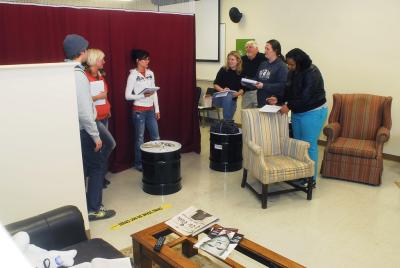 Point Park students in the the Criminal Justice and Intelligence Studies evaluate a mock crime scene.