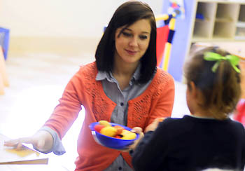 A Point Park education major interacts with a pre-school student at the Watson Institute, an organization that serves children with special needs. | Photo by Christopher Rolinson