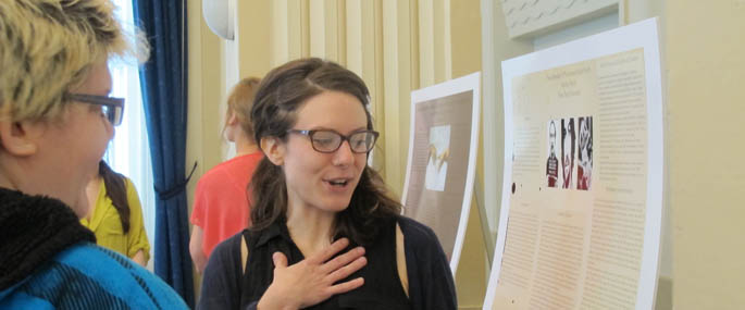Pictured is a psychology student discussing her research poster. | Photo by Amanda Dabbs