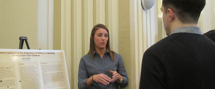 Pictured is a psychology student presenting at the 2014 Humanities and Human Sciences Symposium. | Photo by Amanda Dabbs