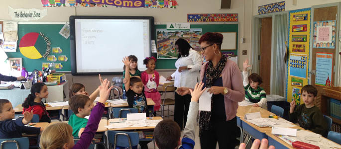 Pictured are Point Park elementary education majors teaching a Junior Achievement lesson at Clara Barton Elementary School. | Photo by Ashley Zahorchak