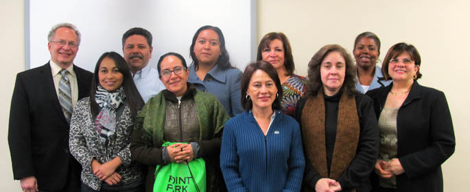 Pictured are Richard Gutkind, Ph.D. and Vincenne Revilla-Beltran, Ph.D. with visitors from Latin and South America. | Photo by Amanda Dabbs