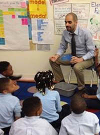 Pictured is elementary education alumnus Michael Suppa teaching his first grade students at D.C. Preparatory Academy. | Photo submitted by Suppa