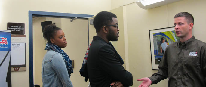 Pictured are Point Park students talking with a representative from the Pennsylvania National Guard at an information session on campus. | Photo by Amanda Dabbs