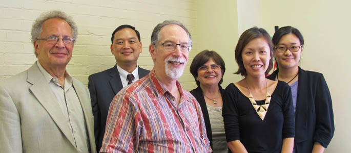 Pictured are Dr. Vincenne Revilla Beltran and Dr. Richard Gutkind with educators from Singapore. | Photo by Amanda Dabbs