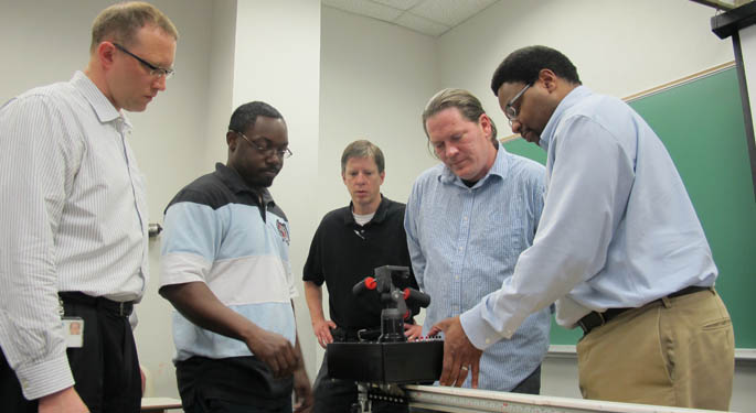 Pictured are Point Park engineering students Ray Fortuna, Demetris Grimsley, Associate Professors Gregg Johnson, Chris Rolinson and Rhyan Cochrane. 