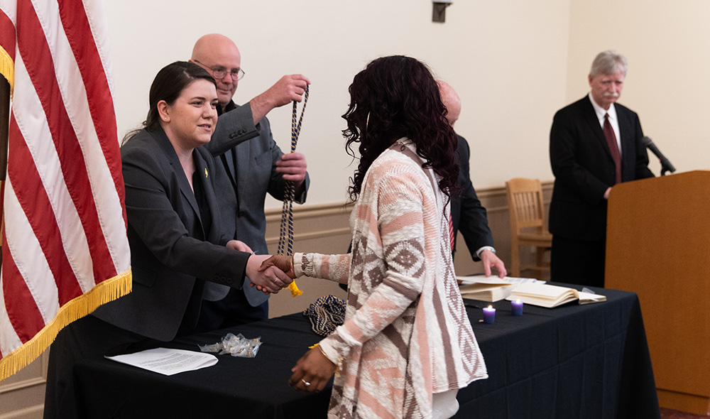 Pictured is the 2019 induction ceremony for Alpha Phi Sigma. Photo by Randall Coleman