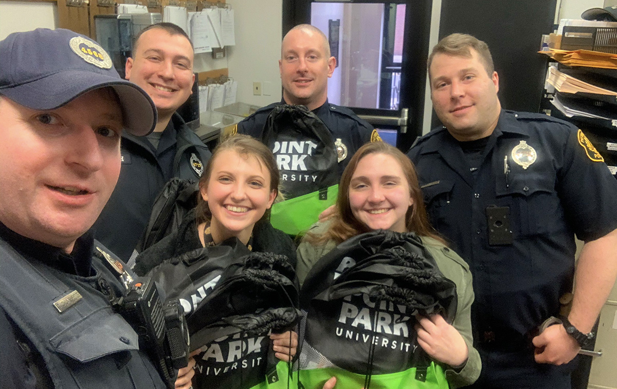 Pictured are Alpha Phi Sigma and Criminal Justice Club officers donating supplies to Pittsburgh Police