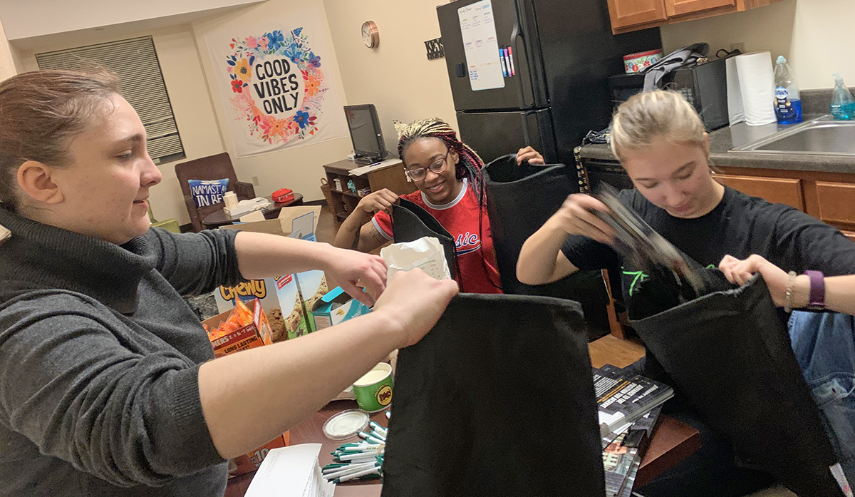 Pictured are Alpha Phi Sigma and Criminal Justice Club officers donating supplies to Pittsburgh Police