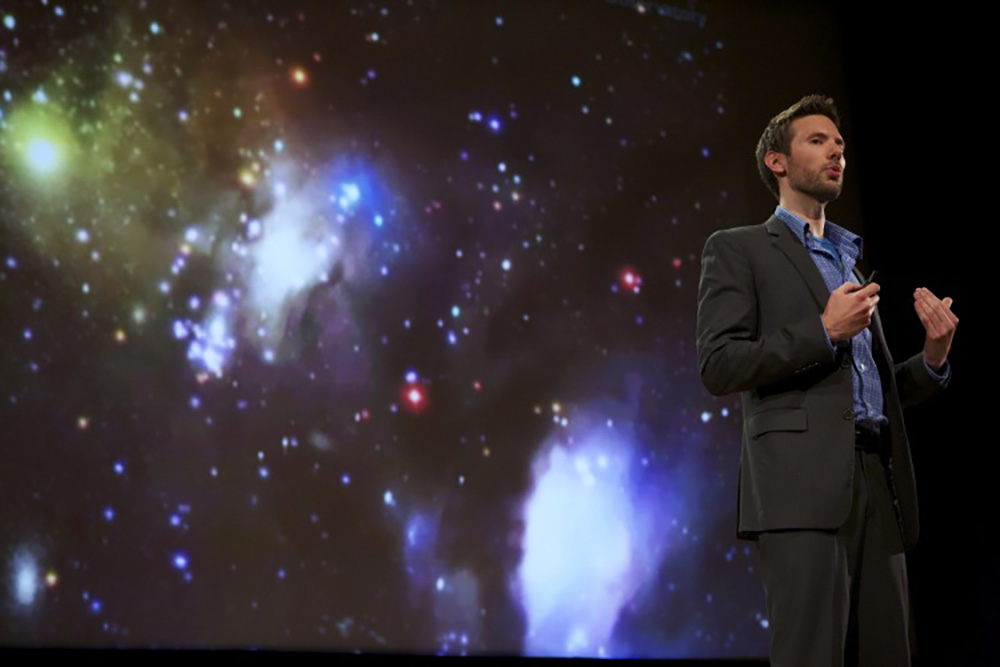 Pictured is Brendan Mullan, Ph.D., speaking at National Geographic's headquarters.