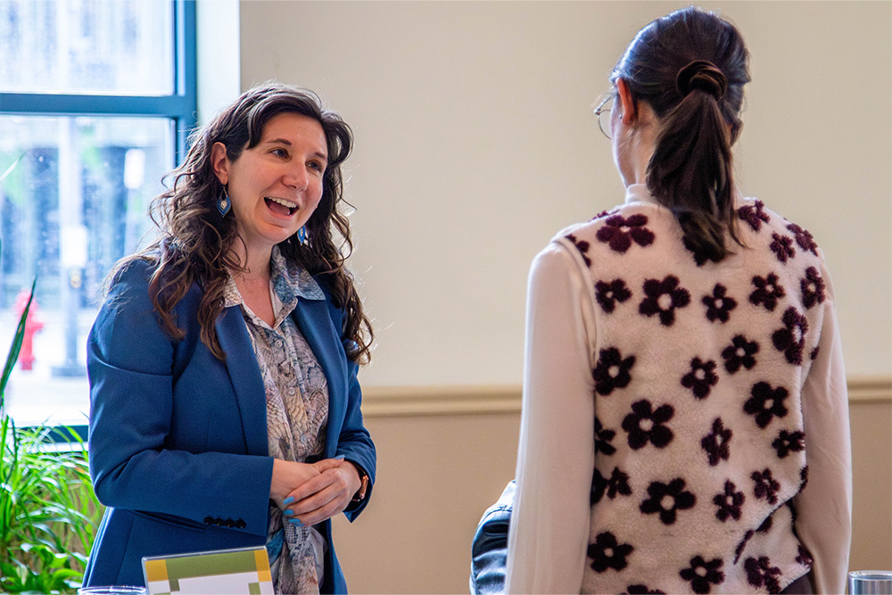Pictured is Britney Brinkman speaking to a student.