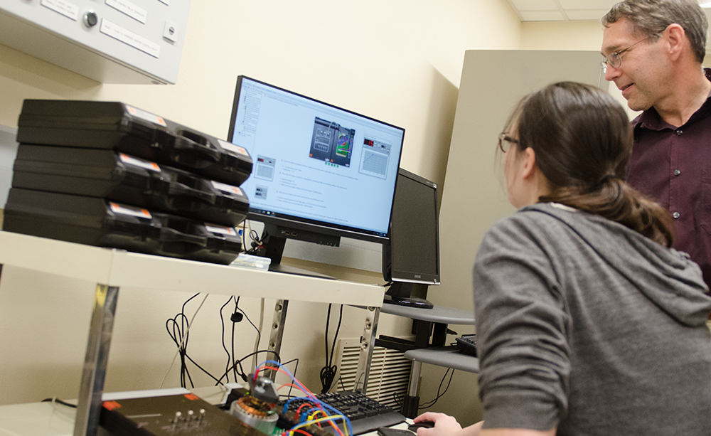 Pictured is Dr. Don Keller working with a student. Photo by Chris Rolinson.