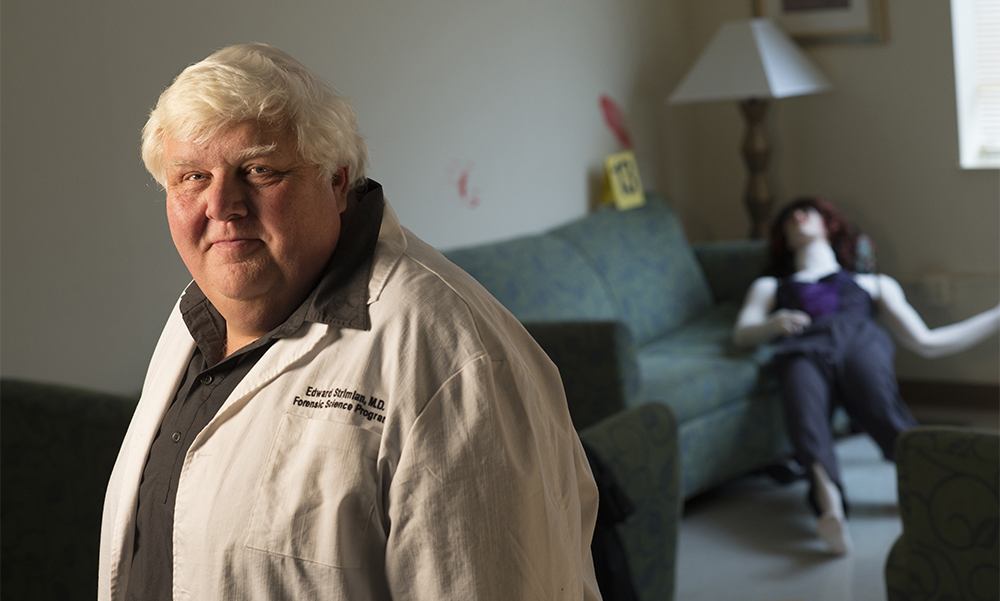 Pictured is Edward Strimlan, M.D., associate professor of forensic science. Photo by Martha Rial.