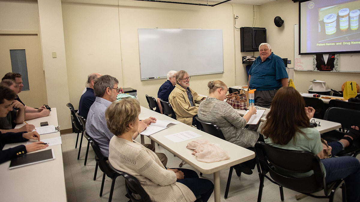 Pictured are members of the Hampton Township Citizens Police Academy at Point Park University's CSI House. Photo by Hannah Johnston.