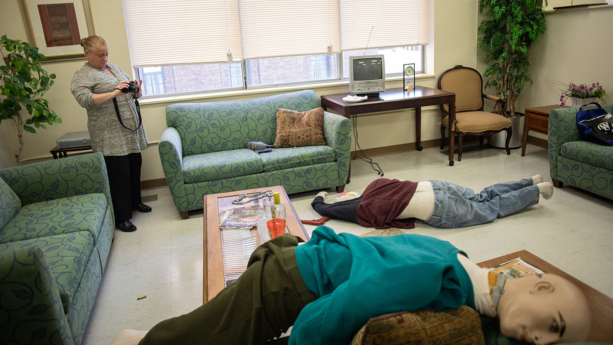 Pictured are members of the Hampton Township Citizens Police Academy at Point Park University's CSI House. Photo by Hannah Johnston.