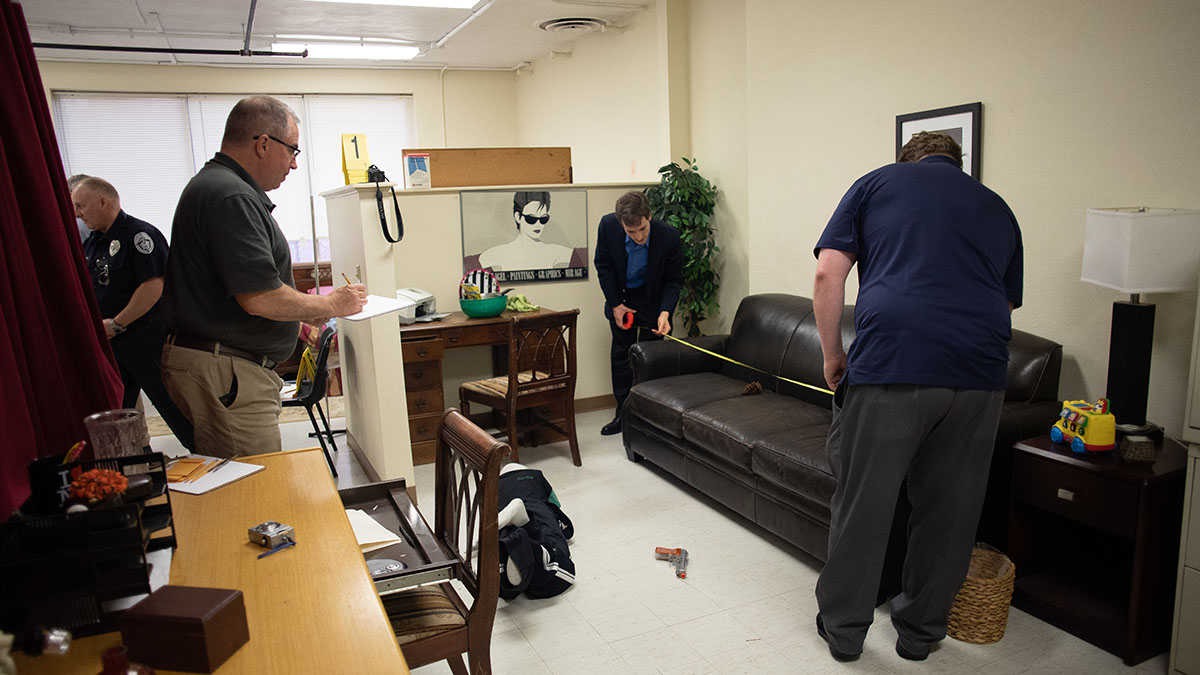 Pictured are members of the Hampton Township Citizens Police Academy at Point Park University's CSI House. Photo by Hannah Johnston.