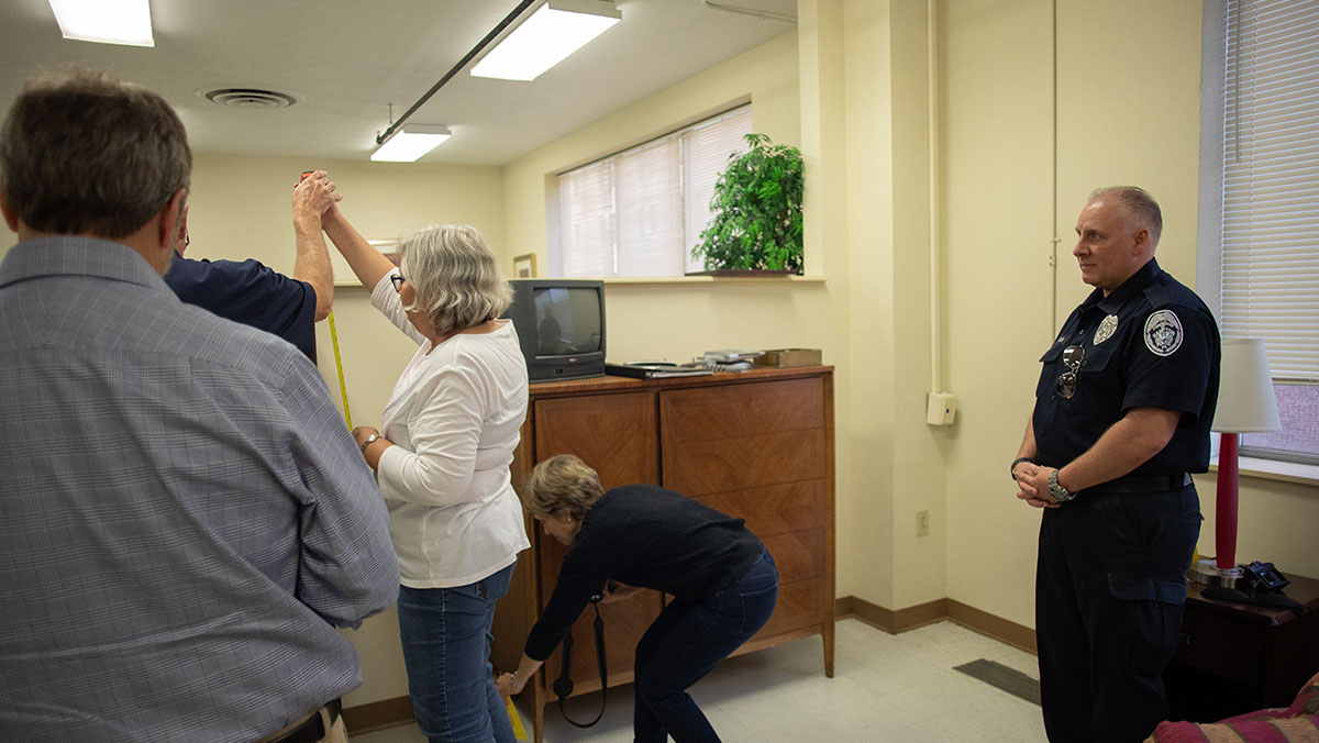 Pictured are members of the Hampton Township Citizens Police Academy at Point Park University's CSI House. Photo by Hannah Johnston.