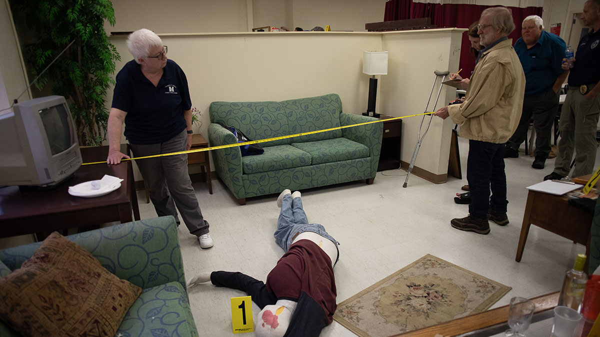 Pictured are members of the Hampton Township Citizens Police Academy at Point Park University's CSI House. Photo by Hannah Johnston.