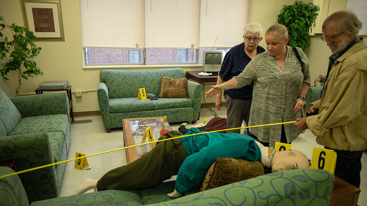 Pictured are members of the Hampton Township Citizens Police Academy at Point Park University's CSI House. Photo by Hannah Johnston.