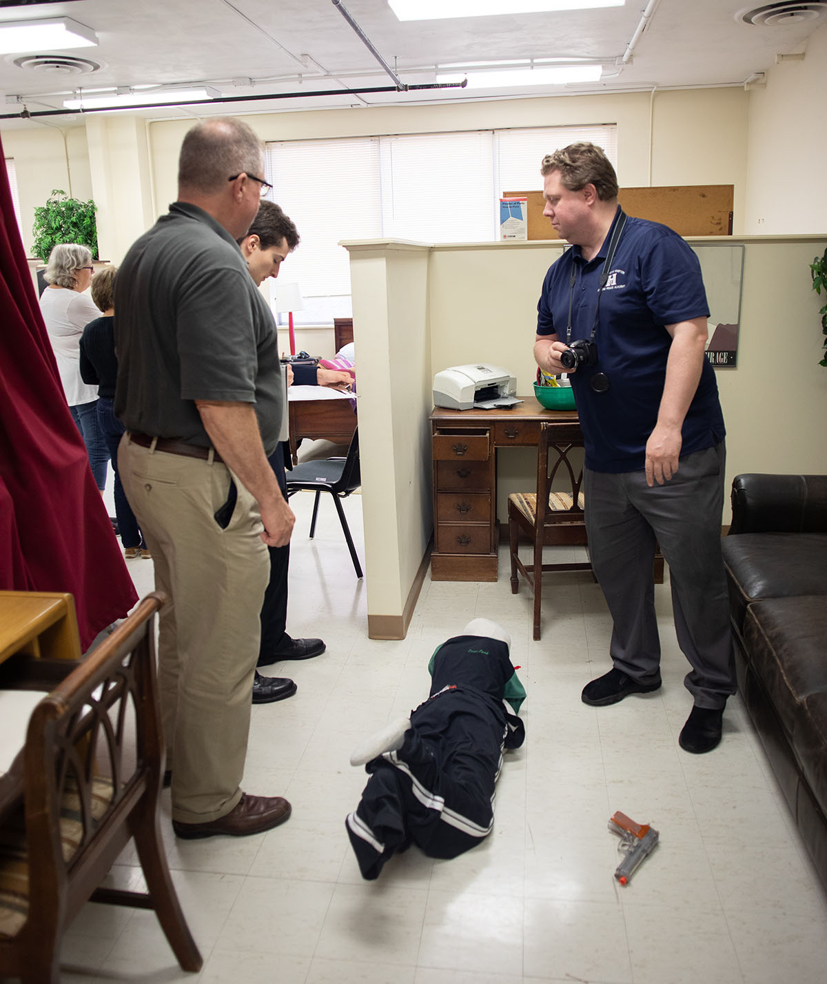 Pictured are members of the Hampton Township Citizens Police Academy at Point Park University's CSI House. Photo by Hannah Johnston.