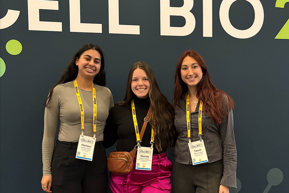 Point Park University stuidents pose for a photo in front of a Cell Bio 2025 sign.