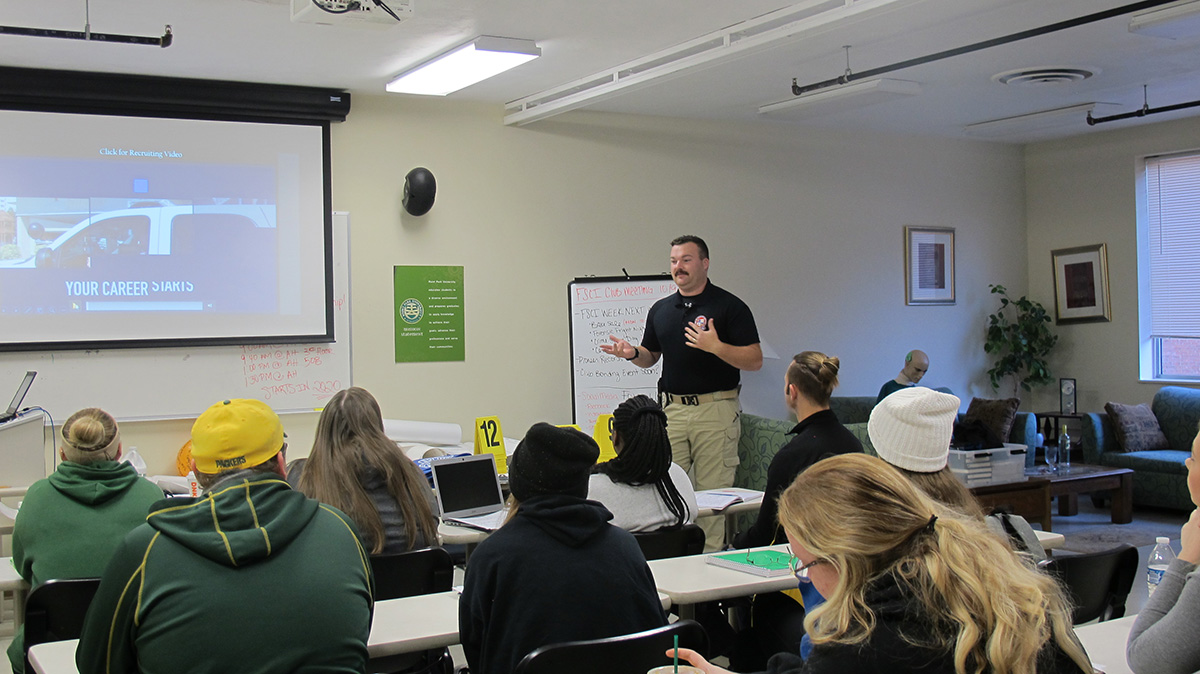 Pictured are Ocean City Police Department officers presenting at Point Park University. Photo by Amanda Dabbs