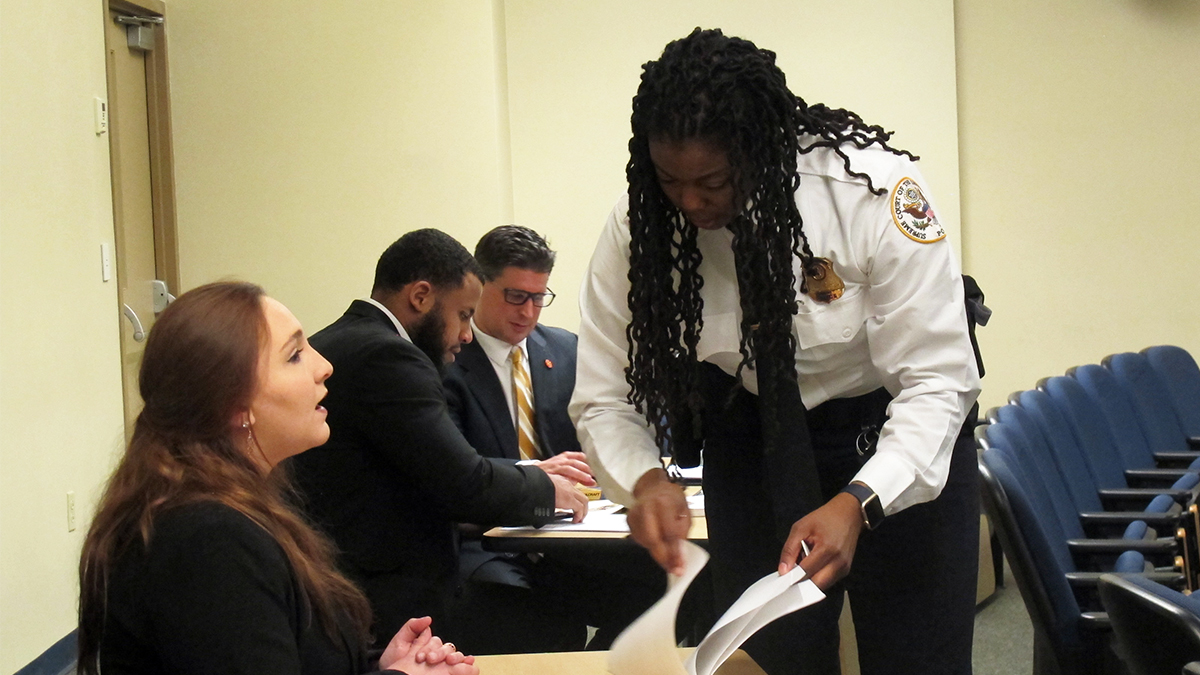 Pictured are U.S. Supreme Court Police Sergeants Charmaine Carr and Mark Hosier with Point Park criminal justice students. Photo by Amanda Dabbs