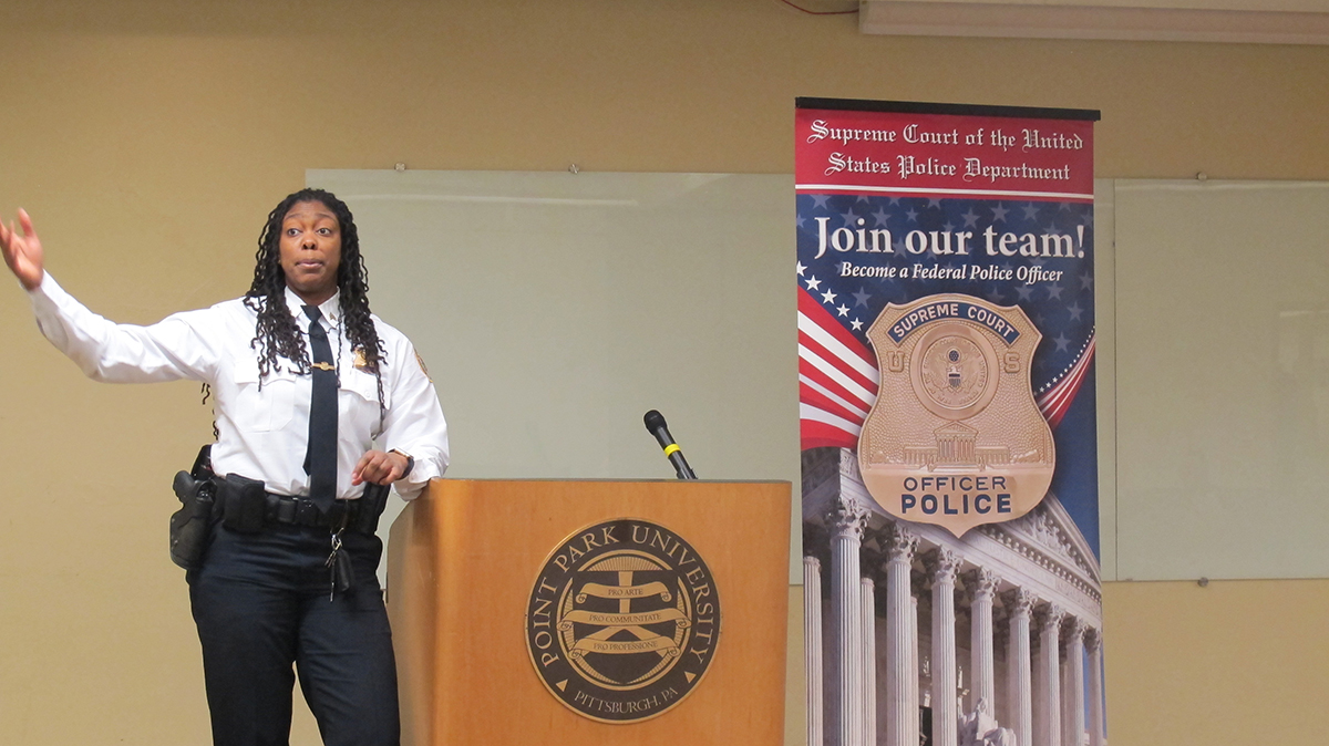 Pictured are U.S. Supreme Court Police Sergeants Charmaine Carr and Mark Hosier with Point Park criminal justice students. Photo by Amanda Dabbs