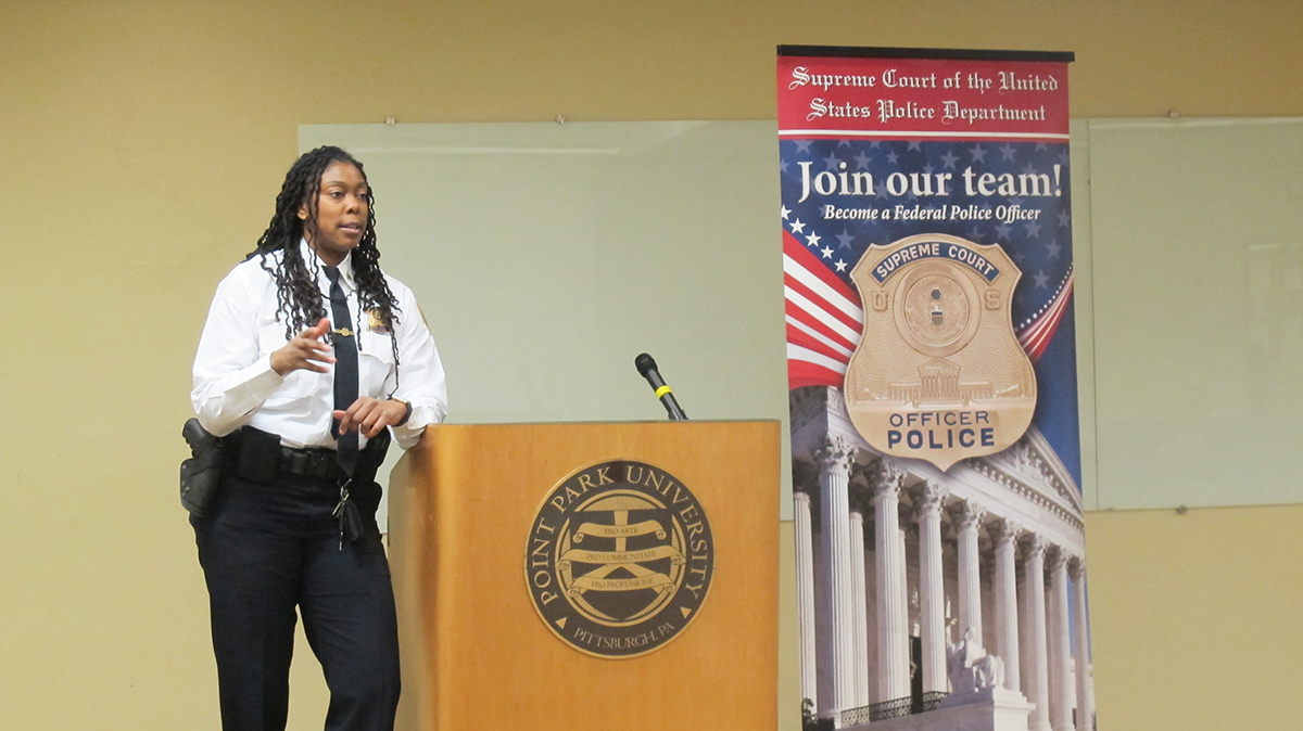 Pictured are U.S. Supreme Court Police Sergeants Charmaine Carr and Mark Hosier with Point Park criminal justice students. Photo by Amanda Dabbs