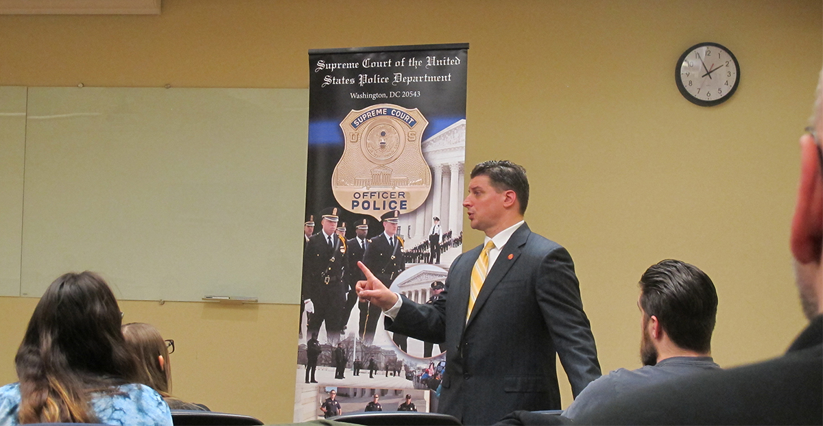 Pictured are U.S. Supreme Court Police Sergeants Charmaine Carr and Mark Hosier with Point Park criminal justice students. Photo by Amanda Dabbs