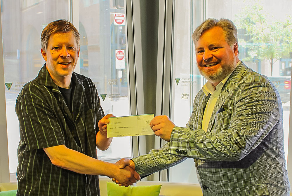 Pictured are Gregg Johnson, chair of Point Park's Department of Natural Sciences, Engineering and Technology, and David Mollish, vice president of human resources for AMETEK's P&AI Division. Photo by Nathaniel Holzer.