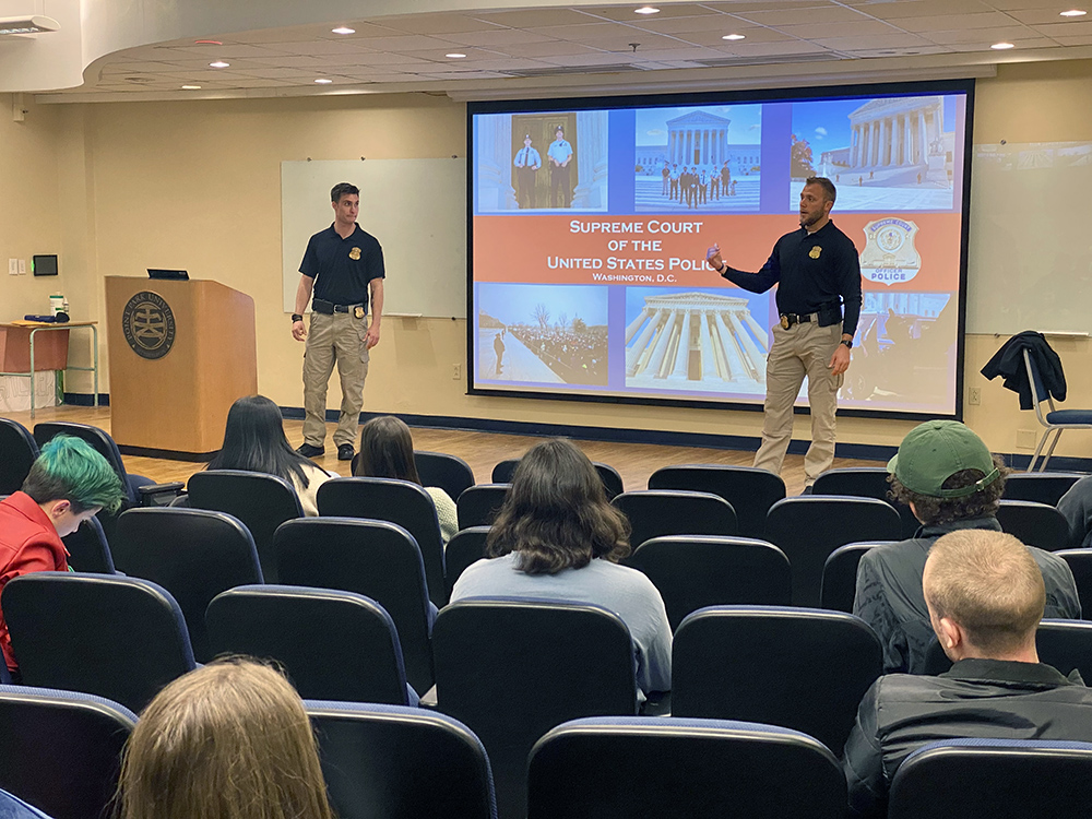 Officers from the Supreme Court of the U.S. Police Department speak to students in Point Park's JVH Auditorium.