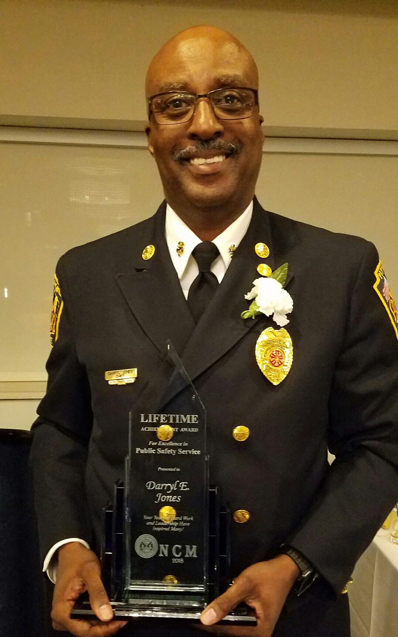 Pictured is Darryl Jones, Ph.D., with the NCM Lifetime Achievement Award. Photo by Ricco J.L. Martello.