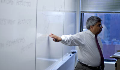 Assistant Professor Archish Maharaja, director of the School of Business M.B.A. program, teaches a graduate class. | Photo by Christopher Rolinson