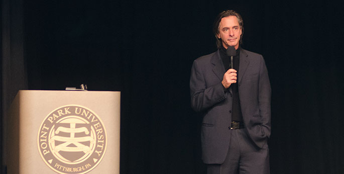 Pictured is Joel Peresman, President and CEO of the Rock and Roll Hall of Fame Foundation, as he speaks to SAEM students at Point Park University. | Photo by Chris Rolinson