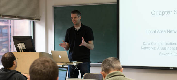 Pictured is Mark Voortman, Ph.D., visiting assistant professor of information technology, teaching class. | Photo by Victoria A. Mikula