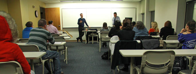 Pictured are accounting professionals Ron and Jeff Mock presenting at an event hosted by Point Park's Student Accounting Association.