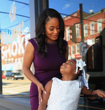 Pictured is Andrea Robinson with her daughter.