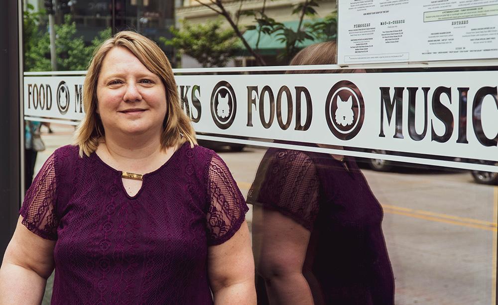 Pictured is SAEM student Tracy Randall at Wolfies Pub. Photo by Emma Federkeil