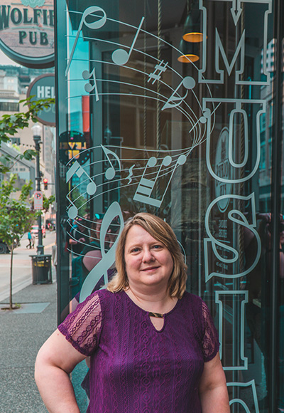 Pictured is SAEM student Tracy Randall at Wolfies Pub. Photo by Emma Federkeil.