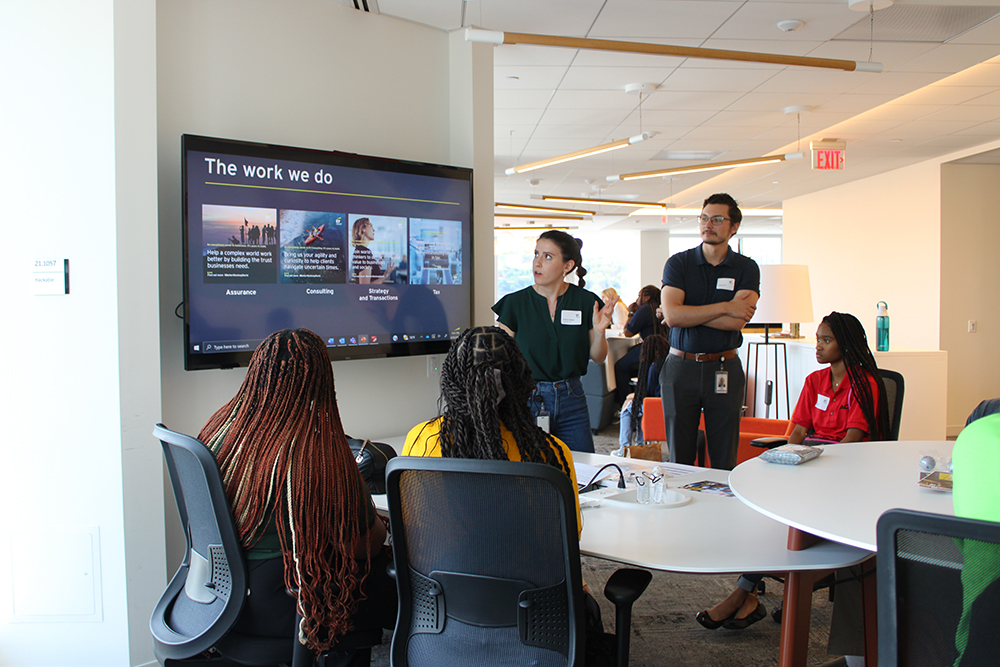 Pictured are Ernst & Young employees and ACAP students during a breakout session. Photo by Nadia Jones.